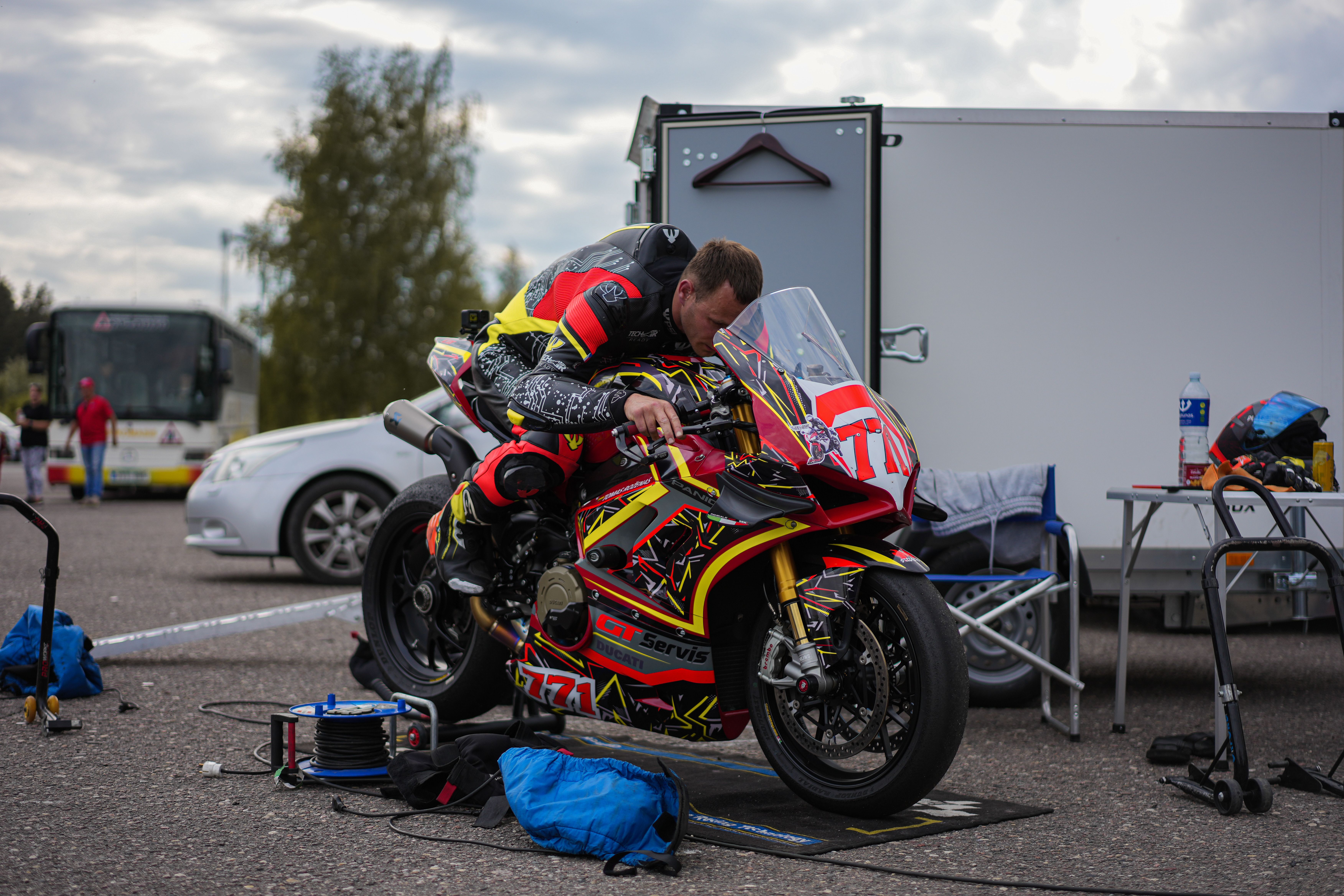 Race motorcycles competing closely with visible number graphics