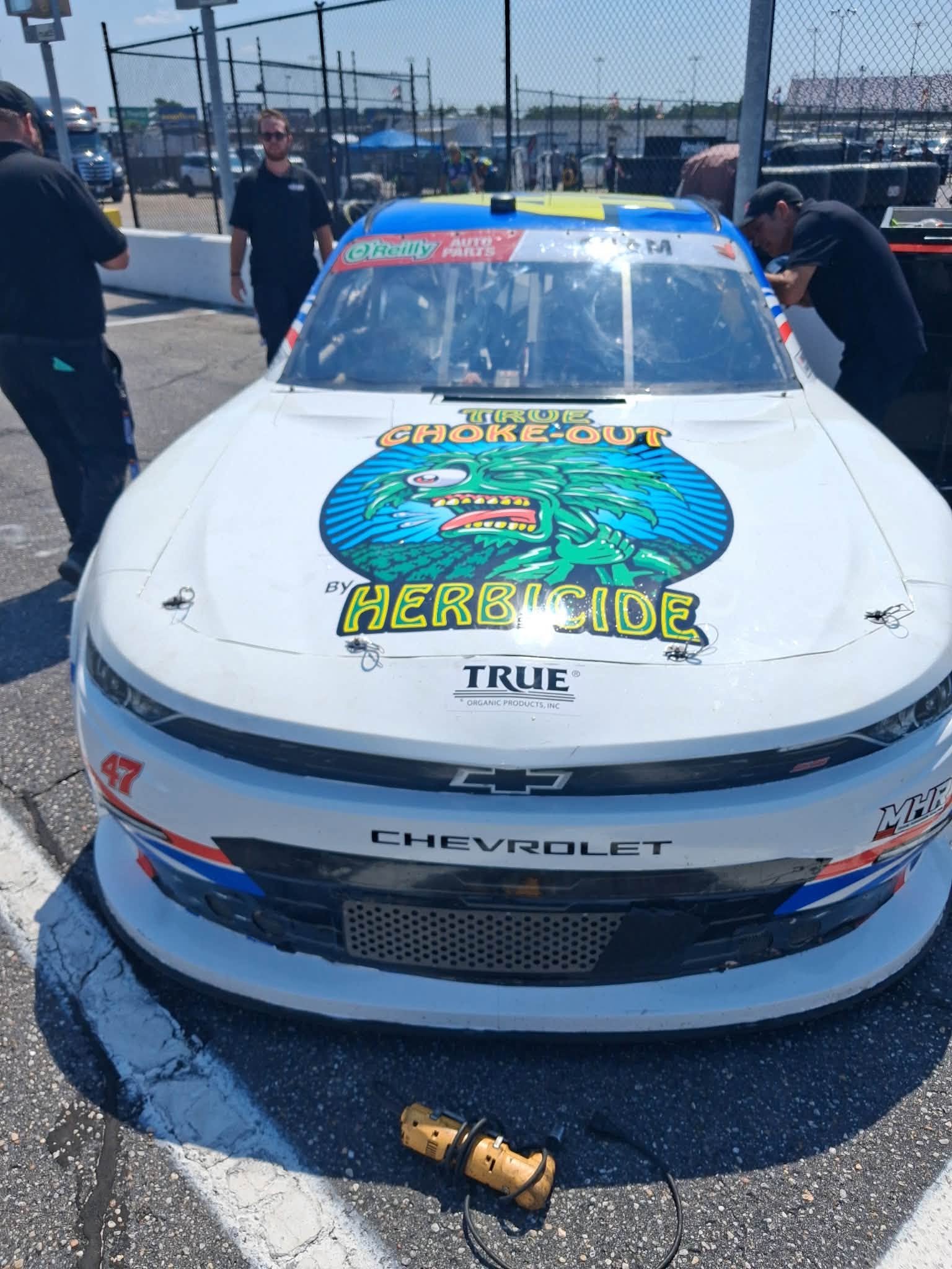 Sponsor decals and logos applied to a race car body panel