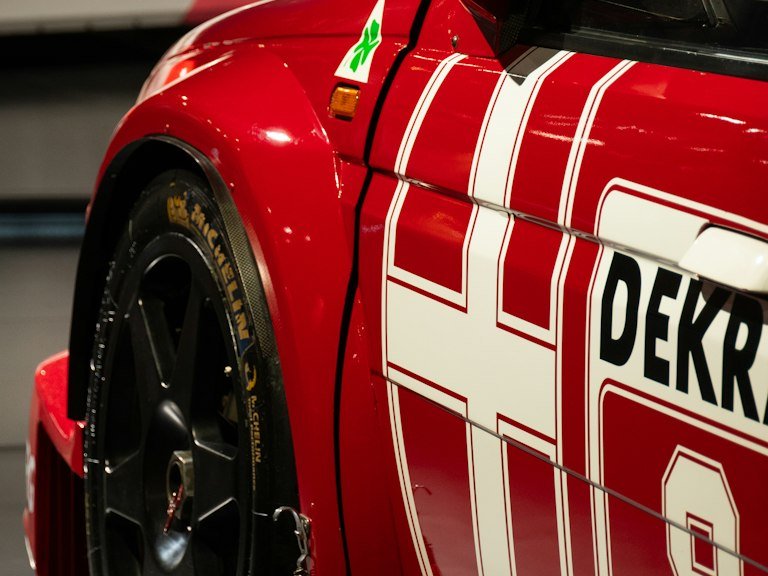Full race car wrap and partial vinyl graphics on a red stock car